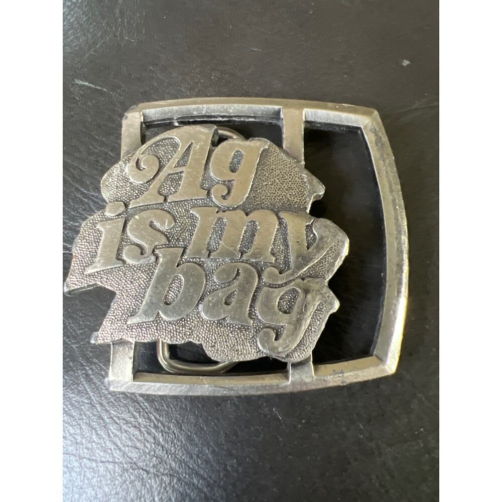 Reman‎ Publications AG is My Bag belt silver buckle OS